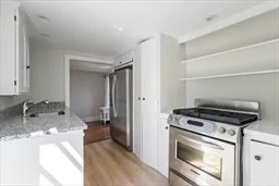 a kitchen with a stove and a sink