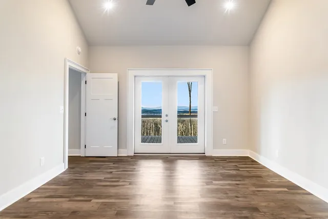 a kitchen with stainless steel appliances granite countertop a stove and a white cabinets