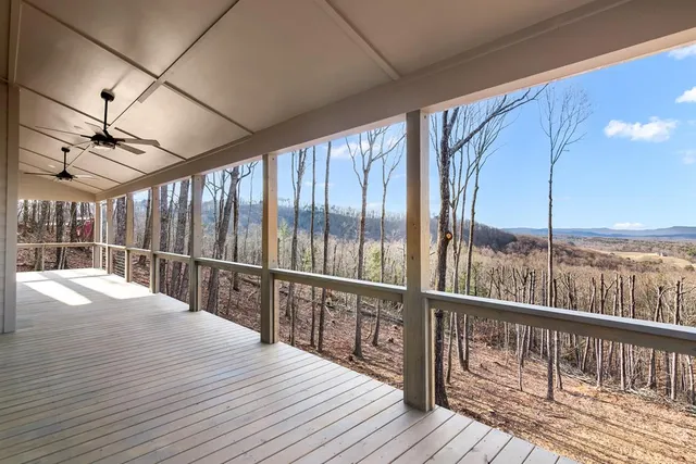 a view of balcony with wooden floor