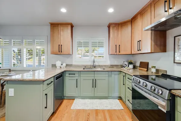 a dining room with furniture and window