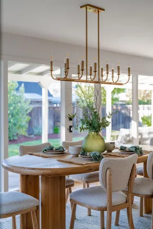 a dining room with furniture and window