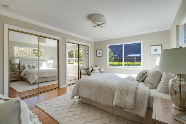 a front view of a house with swimming pool having outdoor seating