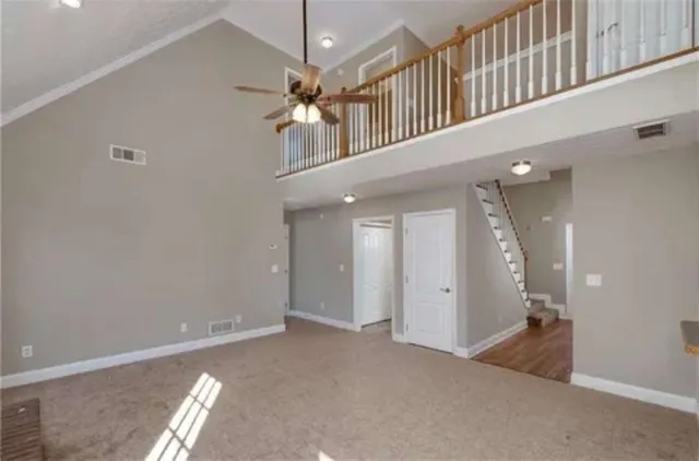 a view of a hallway with chandelier
