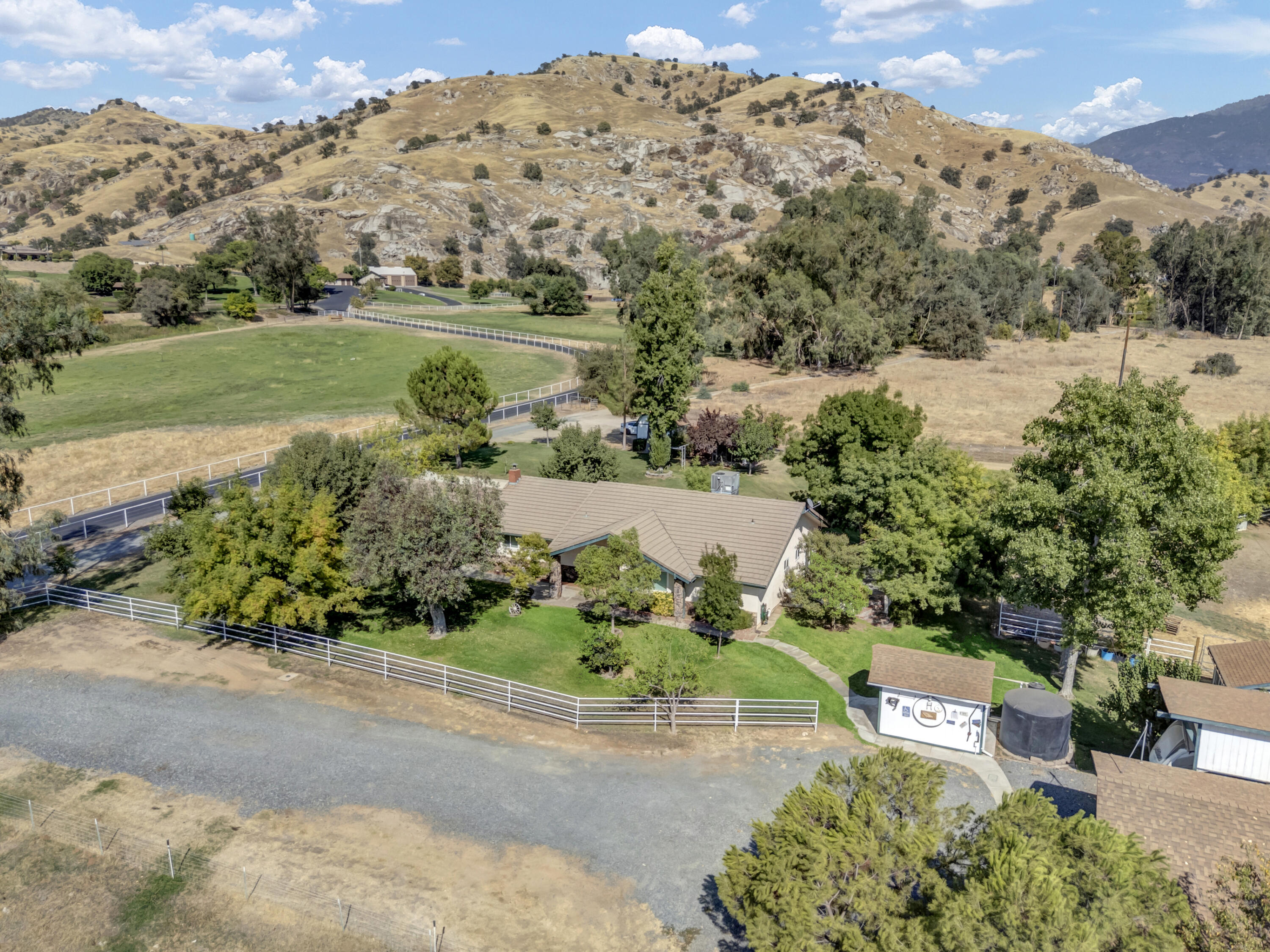 18002 320th Road Springville, CA 93265 - Photo 1 of 56 an aerial view of a house with a yard and lake view