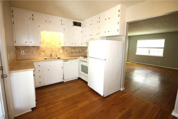 a bathroom with a sink vanity and a mirror