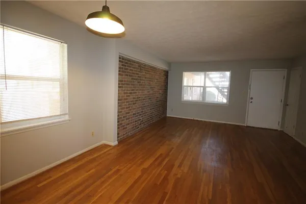 a large kitchen with granite countertop a stove and a sink