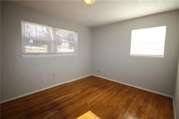 a bathroom with a toilet and a vanity