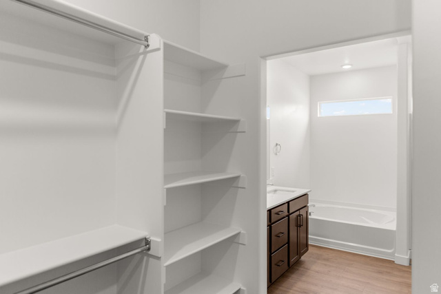 1417 West 2350th South, Unit 14 Perry, UT 84302 - Photo 13 of 19 Walk-in closet with integrated shelving and hanging rods