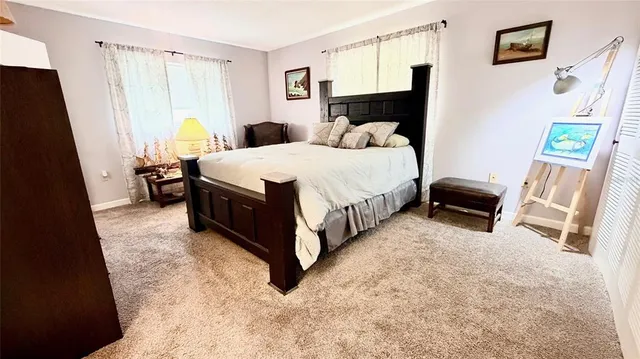 a bed room with a bed and a window