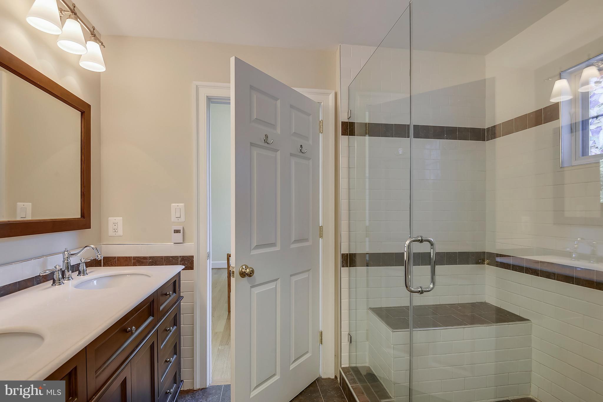 12408 Beall Spring Road Potomac, MD 20854 - Photo 14 of 30 a bathroom with a sink and a mirror