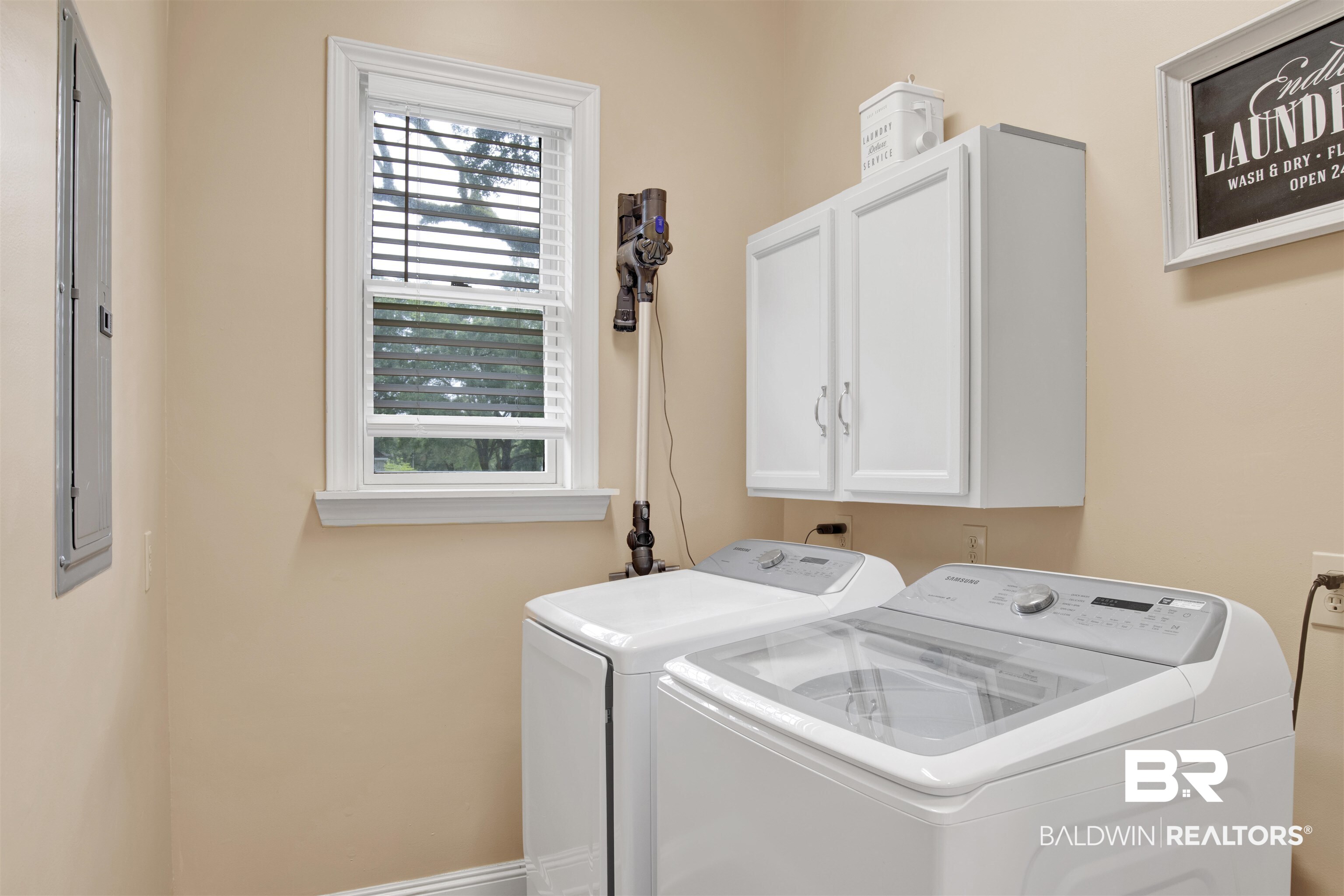 4340 Hamilton Oaks Lane Mobile, AL 36695 - Photo 19 of 51 Clothes washing area with cabinets, a wealth of natural light, and washing machine and clothes dryer