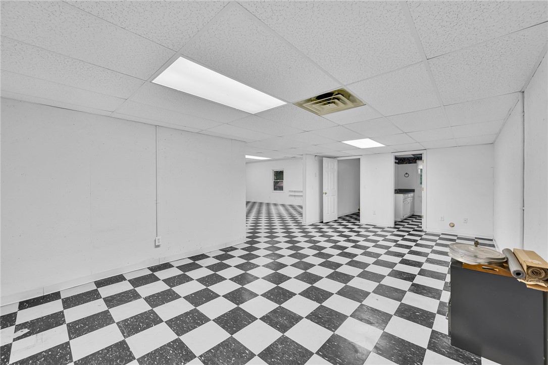 1016 Campbell Road Belton, SC 29627 - Photo 27 of 50 A spacious commercial area with checkerboard flooring and bright overhead lighting offers versatile usage.