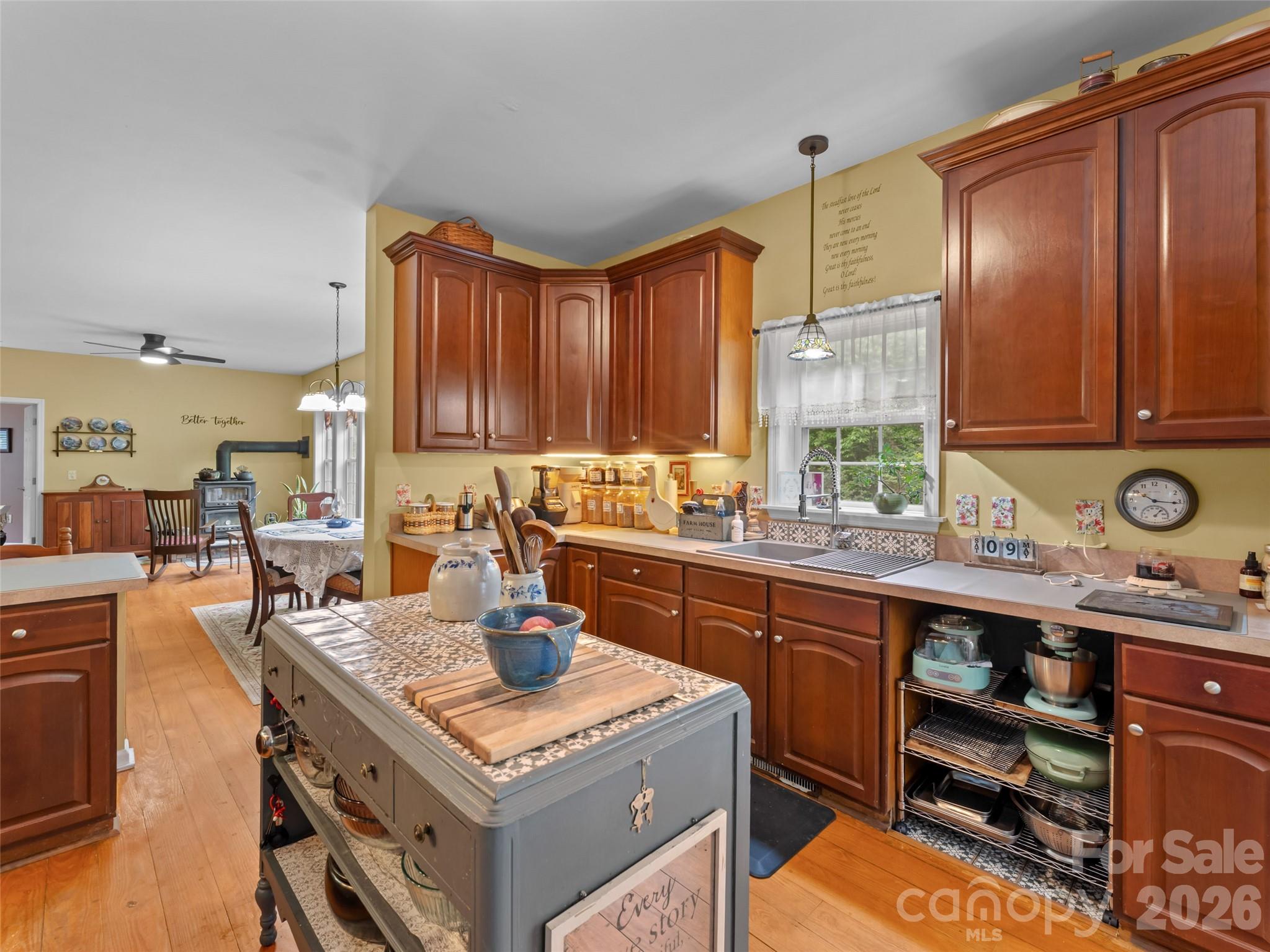 103 Old Southside Road Saluda, NC 28773 - Photo 17 of 48 a kitchen with a stove top oven sink and cabinets