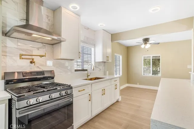 a kitchen with a stove and a sink