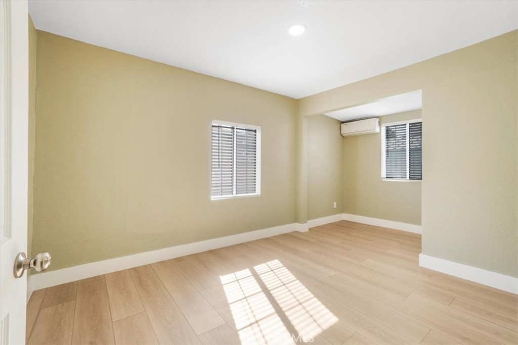 13737 Mercer Street Pacoima, CA 91331 - Photo 14 of 35 an empty room with windows