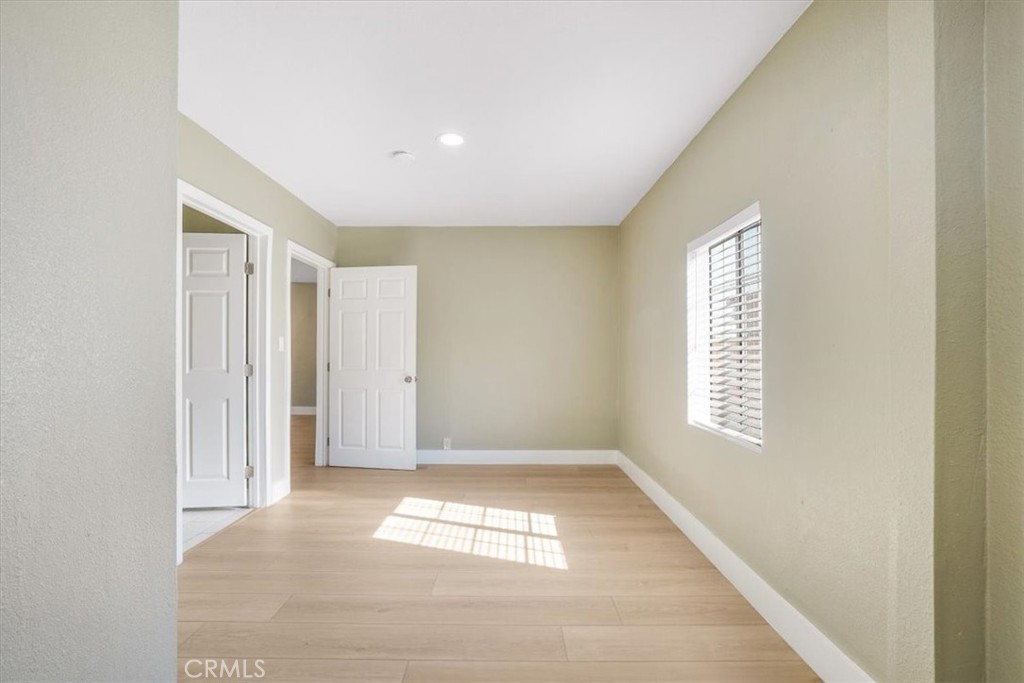 13737 Mercer Street Pacoima, CA 91331 - Photo 16 of 35 a view of empty room with windows