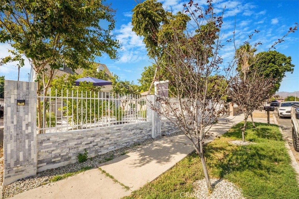 13737 Mercer Street Pacoima, CA 91331 - Photo 2 of 35 a view of a yard with plants and large trees