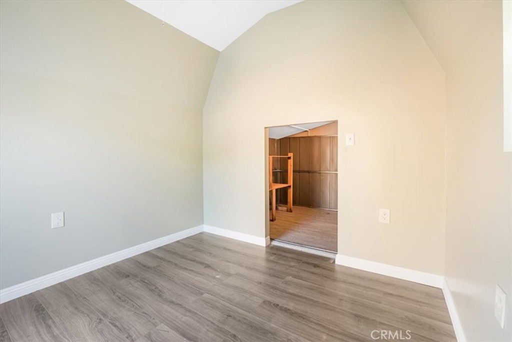 13737 Mercer Street Pacoima, CA 91331 - Photo 29 of 35 a view of empty room with wooden floor and cabinet