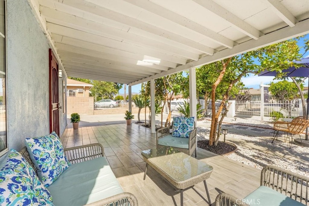13737 Mercer Street Pacoima, CA 91331 - Photo 6 of 35 a living room with patio furniture and floor to ceiling windows