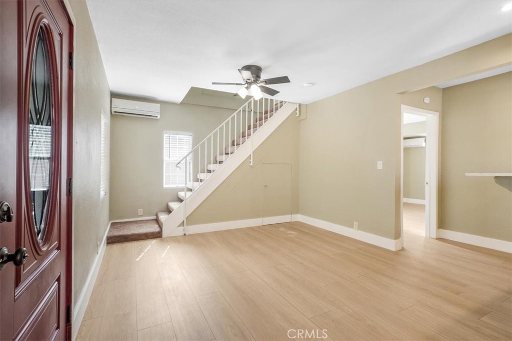 13737 Mercer Street Pacoima, CA 91331 - Photo 7 of 35 a view of entryway with wooden floor