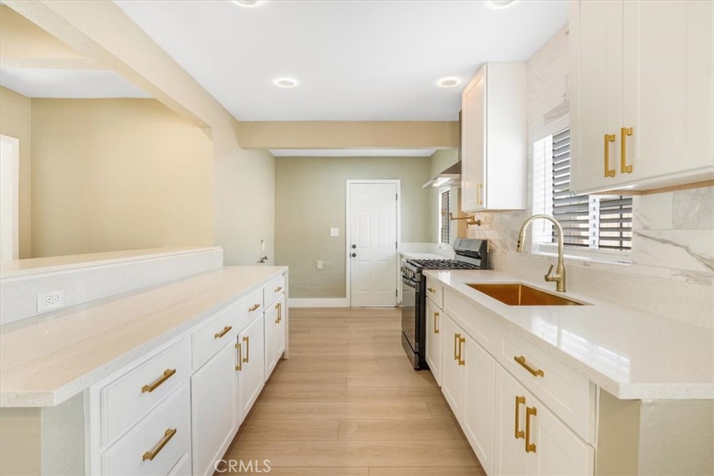 13737 Mercer Street Pacoima, CA 91331 - Photo 10 of 35 a spacious bathroom with double vanity and a bathtub