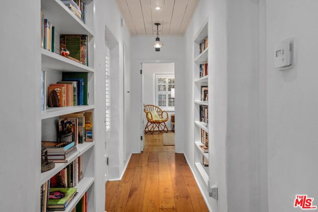 a bedroom with a bed and a lamp on table
