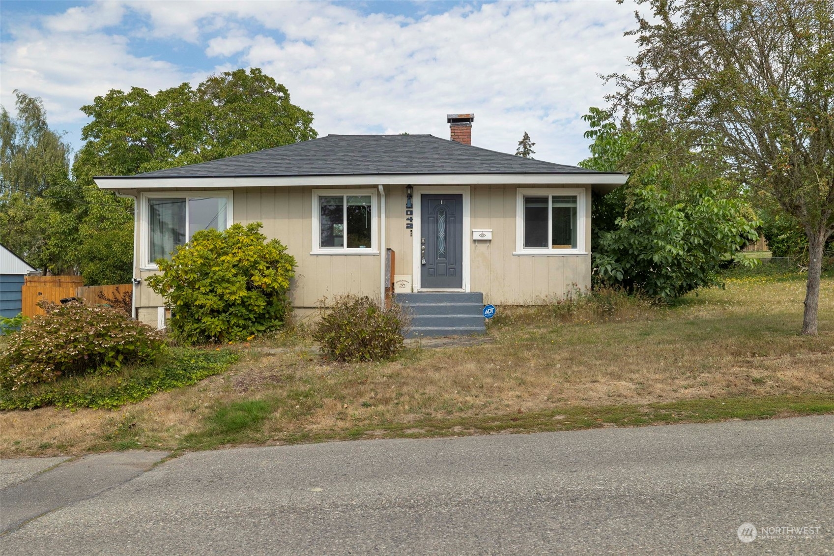 front view of a house with a yard