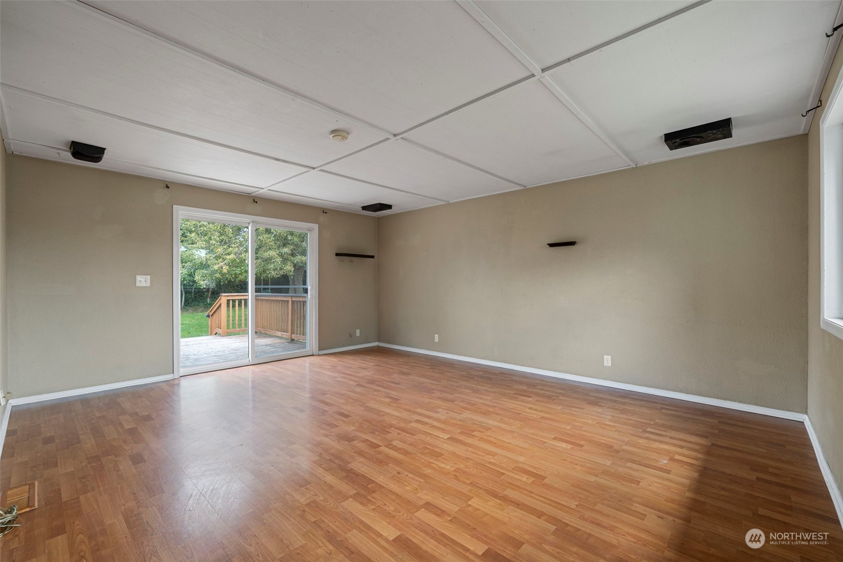 2042 East 18th Street Bremerton, WA 98310 - Photo 11 of 33 a view of an empty room with wooden floor and a window