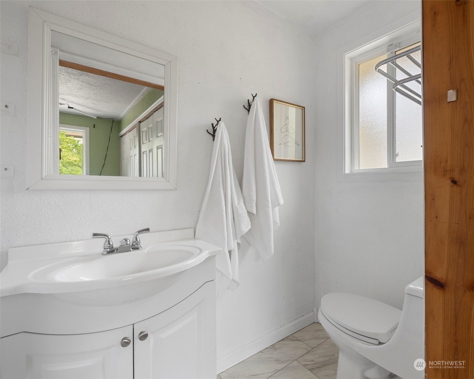2042 East 18th Street Bremerton, WA 98310 - Photo 17 of 33 a bathroom with a sink toilet and mirror