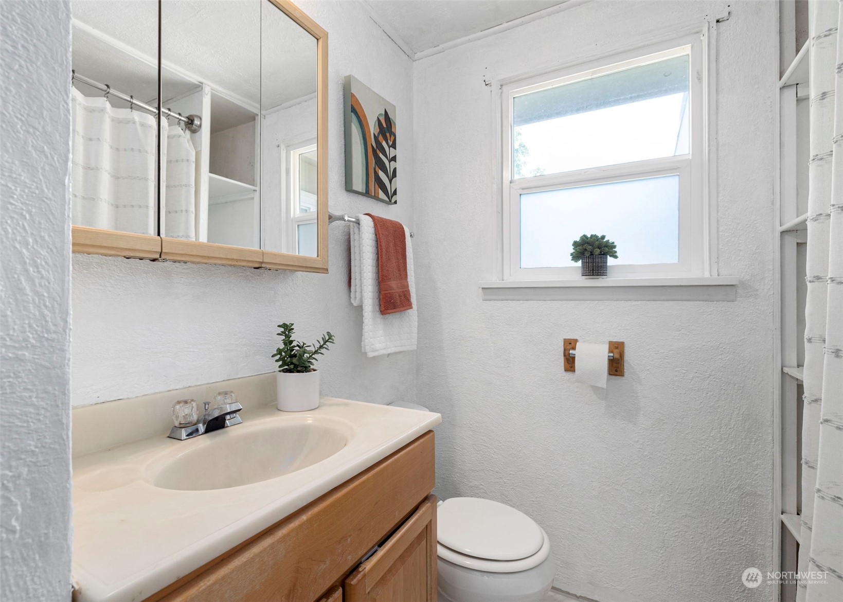 2042 East 18th Street Bremerton, WA 98310 - Photo 20 of 33 a bathroom with a sink a toilet and a bathtub