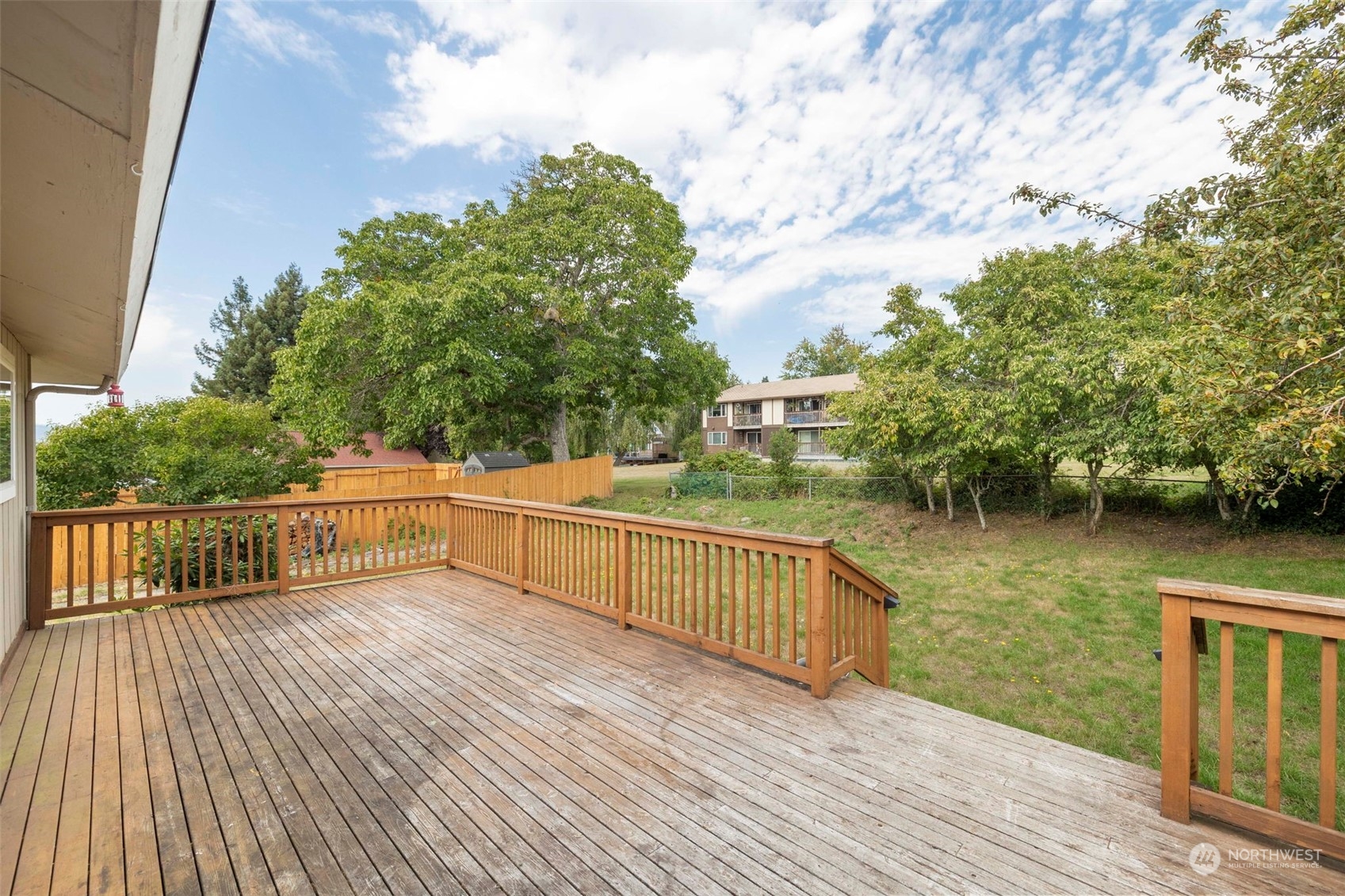 2042 East 18th Street Bremerton, WA 98310 - Photo 23 of 33 a view of balcony with wooden floor and lake view