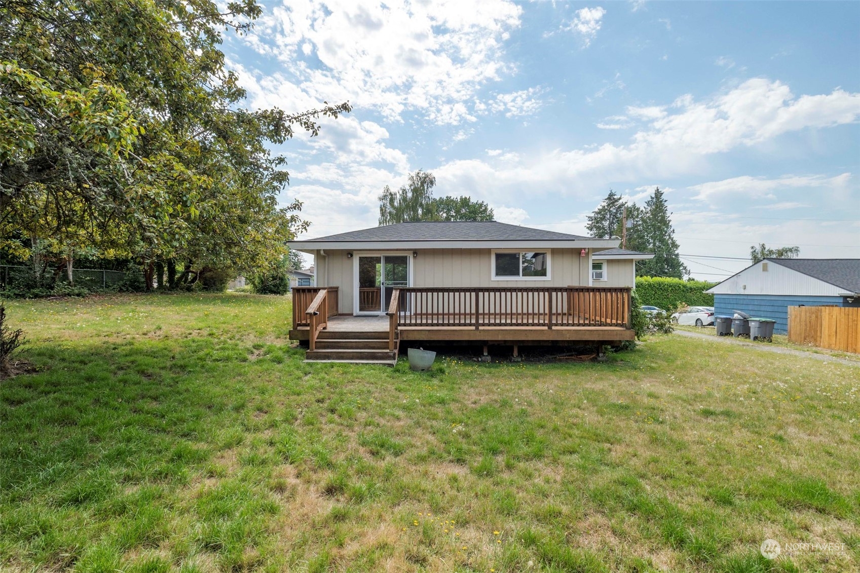 2042 East 18th Street Bremerton, WA 98310 - Photo 26 of 33 a view of house with a big yard and large trees