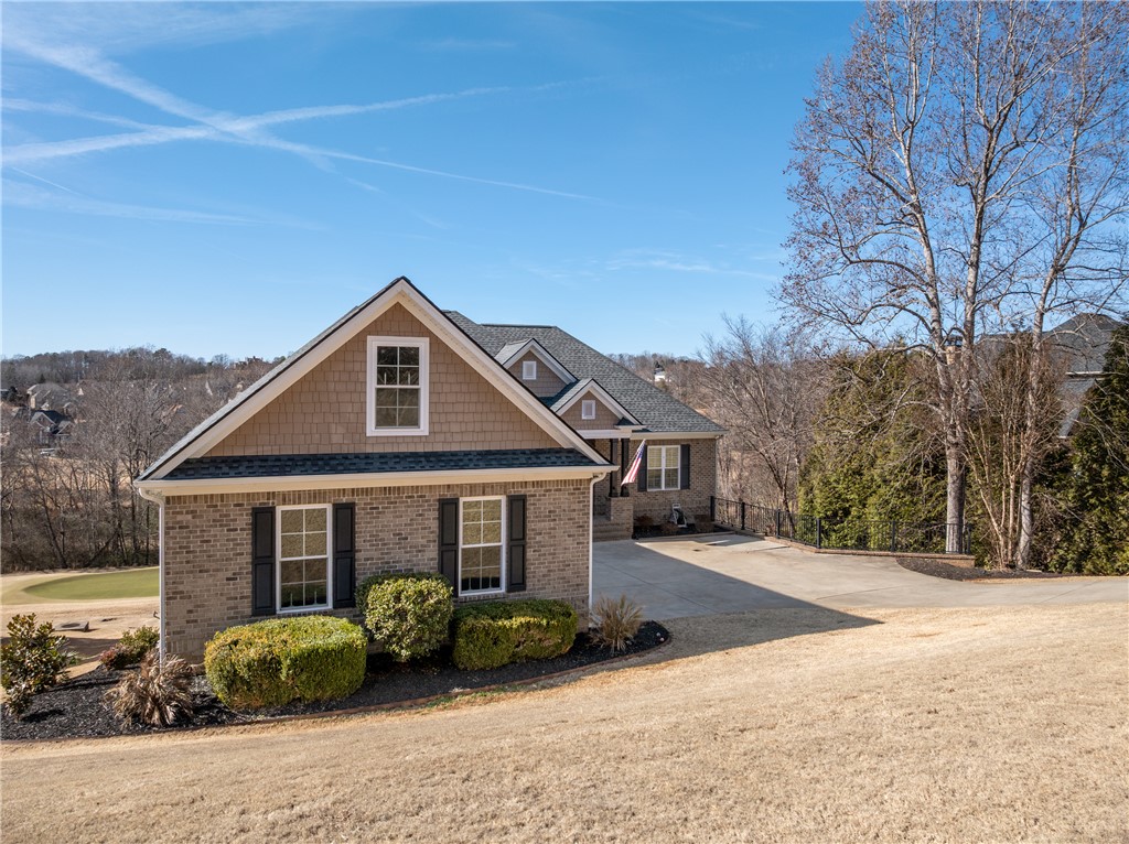 119 Turnberry Road Anderson, SC 29621 - Photo 2 of 50 This charming residence offers a picturesque setting with mature trees and a manicured lawn.