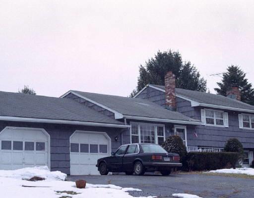 28 Sharon Road Trumbull, CT 06611 - Photo 1 of 1 a front view of a house with a yard