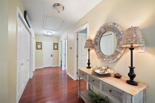 a kitchen with a sink a refrigerator and cabinets