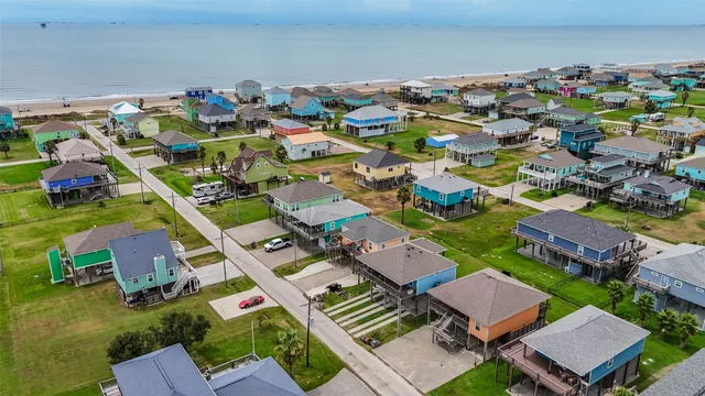 an aerial view of a houses with outdoor space