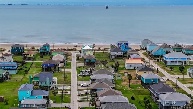 an aerial view of a houses with outdoor space