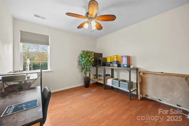 a work room with furniture and a window