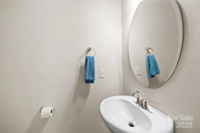 a bathroom with a shower a toilet and sink
