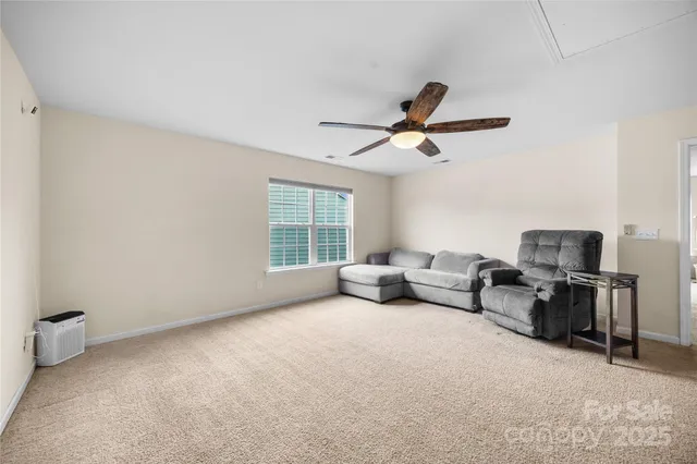 a front view of a house with yard and green space