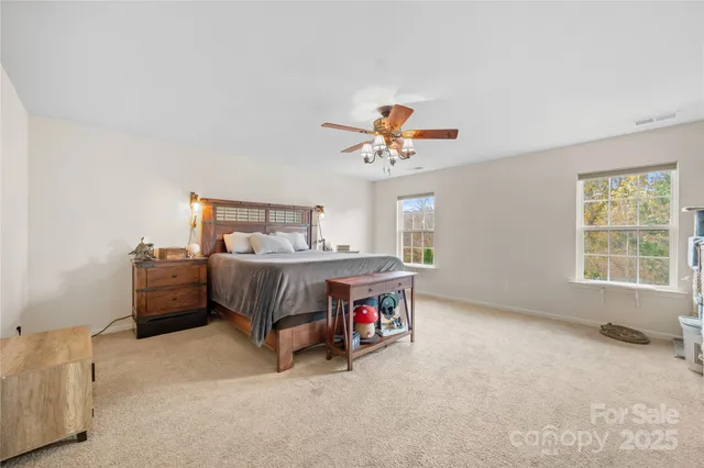 a view of a patio with a table chairs and a backyard