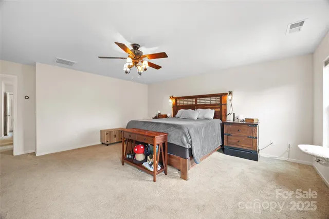 a view of a patio with a table and chairs under an umbrella