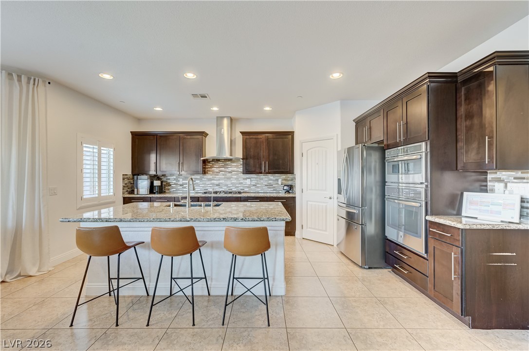 176 Kirkton Street Henderson, NV 89012 - Photo 19 of 80 Granite countertops paired with custom cabinetry for timeless style
