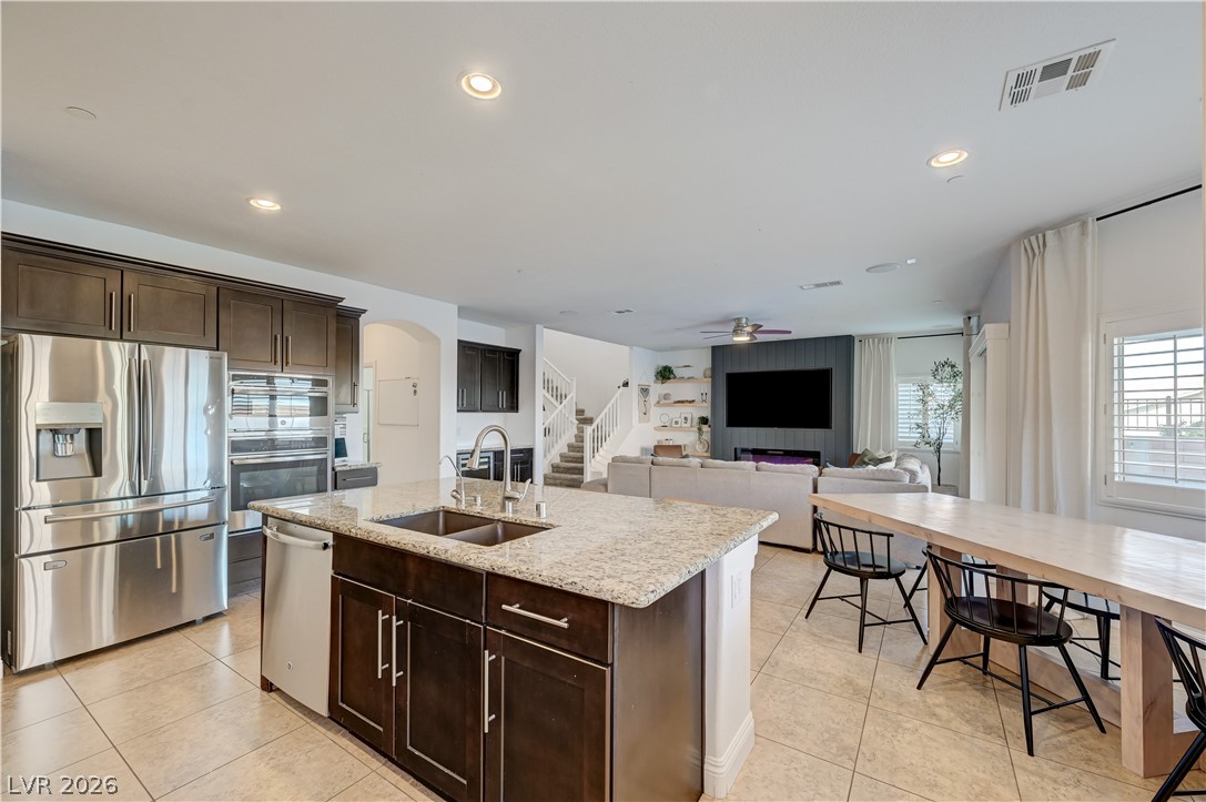 176 Kirkton Street Henderson, NV 89012 - Photo 24 of 80 Open-concept design connecting seamlessly to kitchen and dining areas