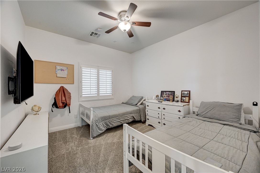 176 Kirkton Street Henderson, NV 89012 - Photo 27 of 80 Convenient main-level bedroom 1 ~ perfect for guests or multigenerational living