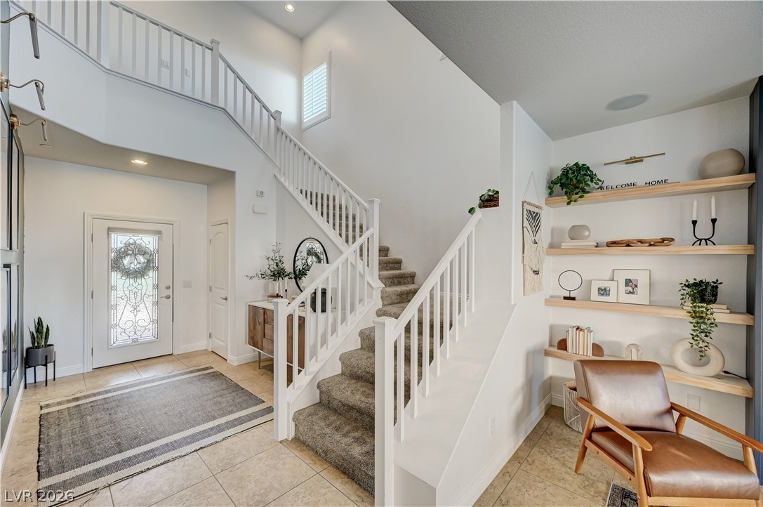 176 Kirkton Street Henderson, NV 89012 - Photo 32 of 80 Grand entry featuring soaring vaulted ceilings and abundant natural light