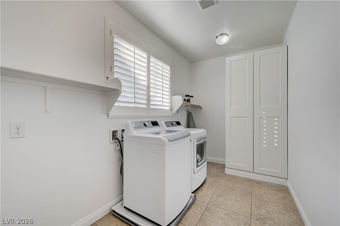 176 Kirkton Street Henderson, NV 89012 - Photo 52 of 80 Spacious upstairs laundry area designed for functionality and organization