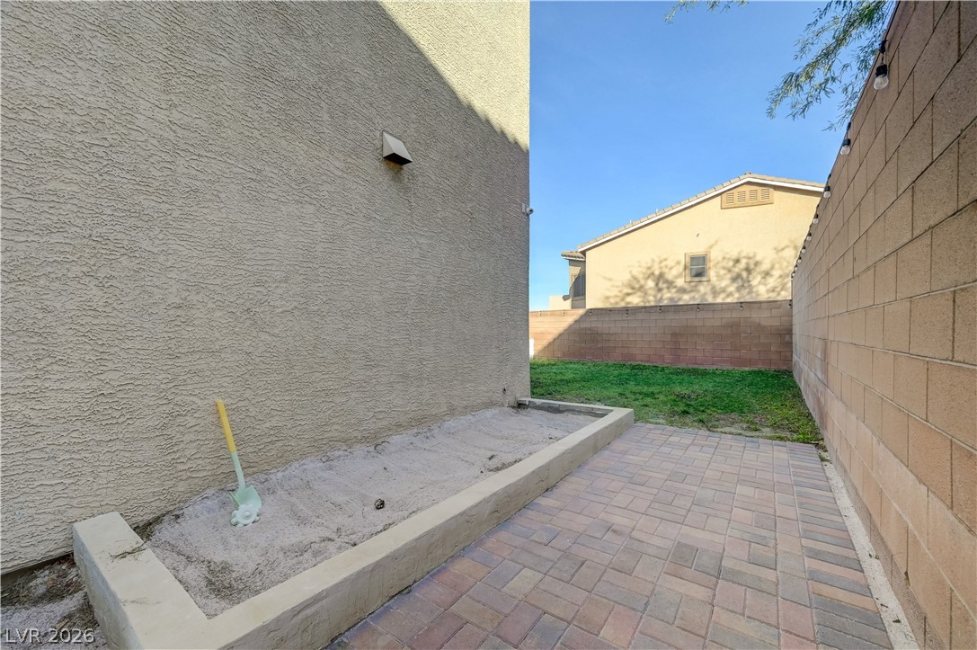 176 Kirkton Street Henderson, NV 89012 - Photo 73 of 80 Dedicated sandbox play area perfect for outdoor fun and creativity