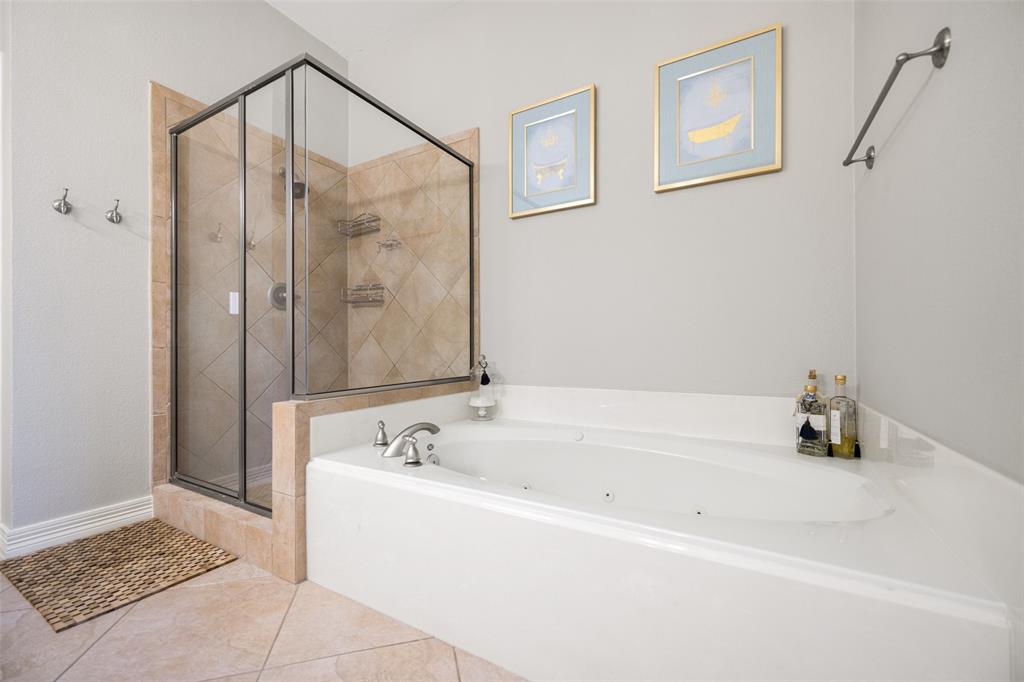 3610 Gillespie Street, Unit 6 Dallas, TX 75219 - Photo 11 of 27 a bathroom with a bathtub and a shower