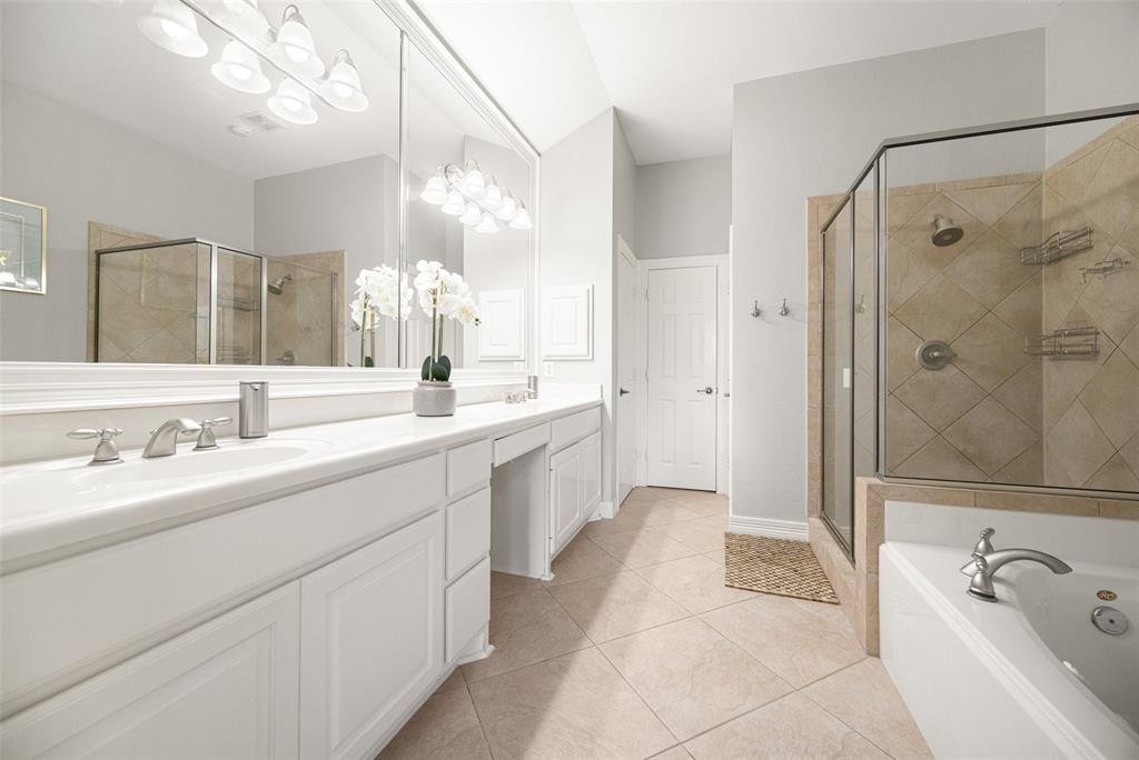 3610 Gillespie Street, Unit 6 Dallas, TX 75219 - Photo 12 of 27 a spacious bathroom with a double vanity sink mirror double and shower